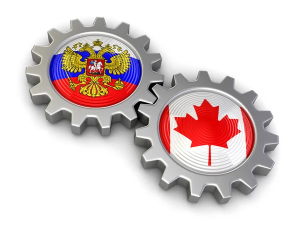 Drapeaux russes et canadiens sur un engrenage (chemin de coupe inclus ) — Photo