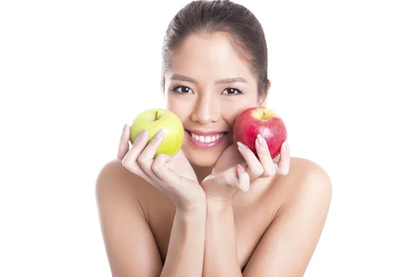 Beautiful young asian woman with flawless skin and perfect make-up, holding apple — Stock Photo, Image