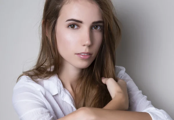 Beautiful young woman with long hair — Stock Photo, Image