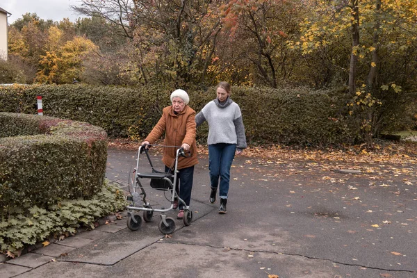 Elderly Woman Taking Walk Granddaughter Help Walker Winter — Stock Photo, Image