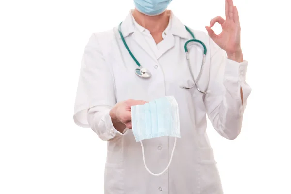 Young Doctor White Uniform Stethoscope Wearing Mask Showing Sign Isolated — Stock Photo, Image