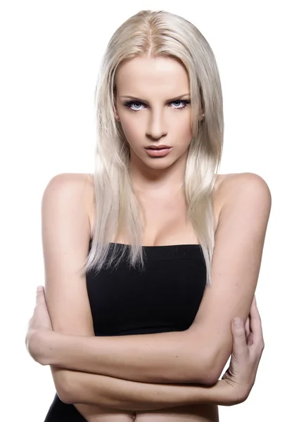 Schöne junge Frau mit blonden Haaren und makelloser Haut posiert mit perfektem Make-up auf isoliertem Hintergrund — Stockfoto