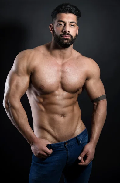 Hermoso musculoso joven culturista Imagen De Stock