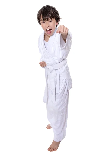 Young asian boy isolated on white in judo clothing doing martial arts — Stock Photo, Image