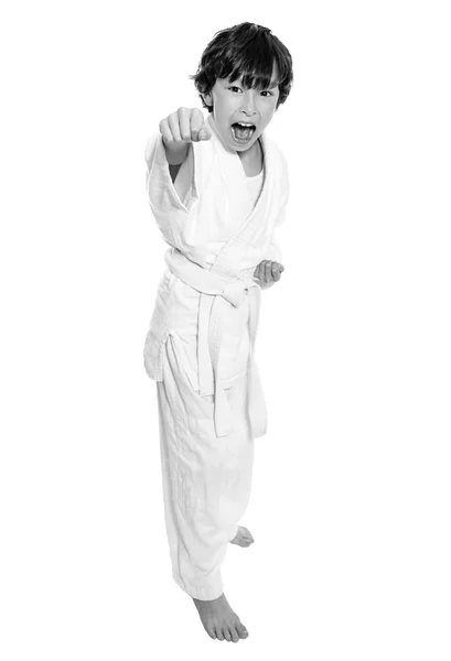 Young asian boy isolated on white in judo clothing doing martial arts — Stock Photo, Image