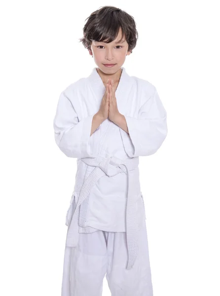 Young asian boy isolated on white in judo clothing doing martial arts — Stock Photo, Image