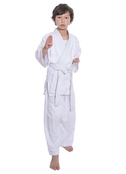 Young asian boy isolated on white in judo clothing doing martial arts — Stock Photo, Image