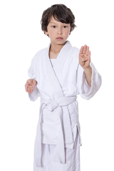 Young asian boy isolated on white in judo clothing doing martial arts — Stock Photo, Image