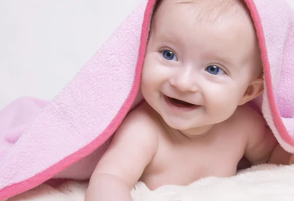Baby on blanket and smiling — Stock Photo, Image