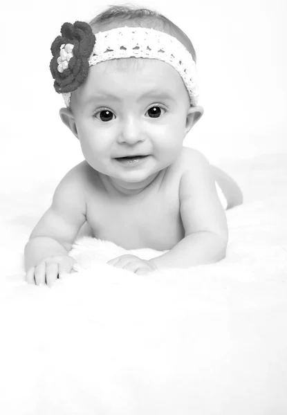 Baby on blanket and smiling — Stock Photo, Image