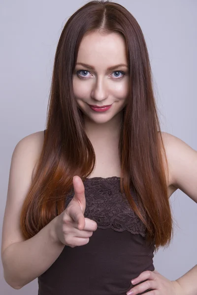 Beautiful young red haired woman cheerfully — Stock Photo, Image