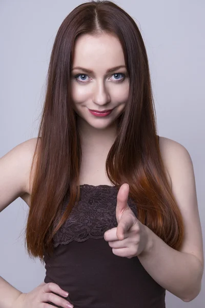 Beautiful young red haired woman cheerfully — Stock Photo, Image