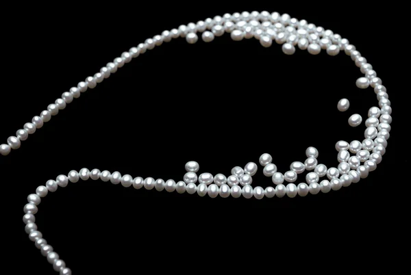 Beautiful pearls on black — Stock Photo, Image
