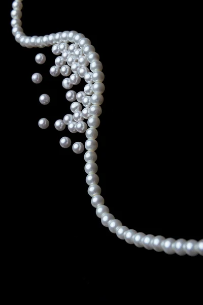 Beautiful pearls on black — Stock Photo, Image