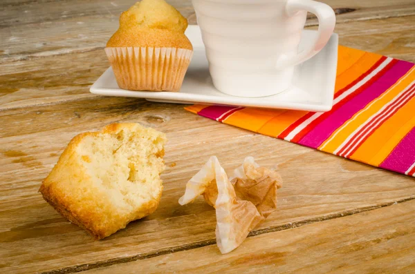 Bitten muffin on table — Stock Photo, Image