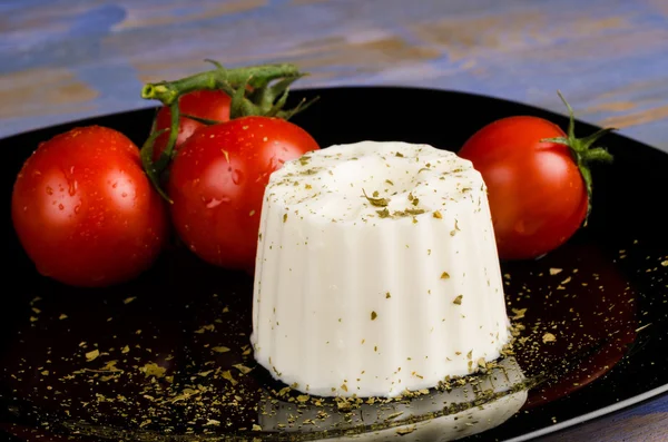 Fresh cheese with tomatoes — Stock Photo, Image