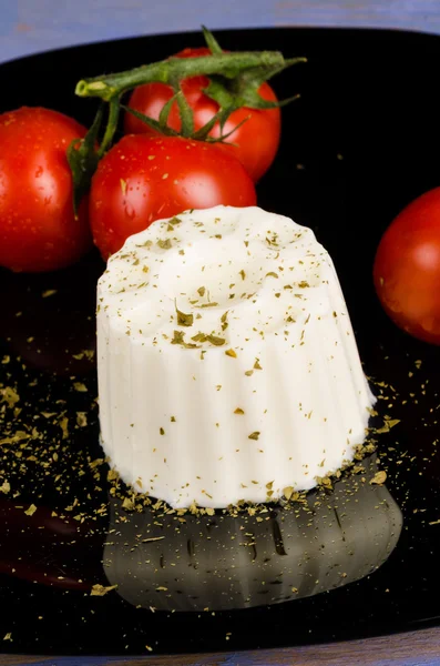 Fresh cheese with tomatoes — Stock Photo, Image