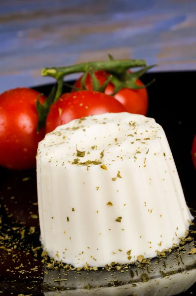 Fresh cheese with tomatoes — Stock Photo, Image