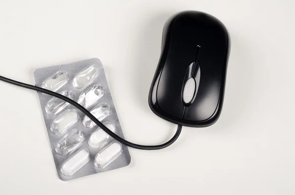 Blister para comprimidos e ratinho — Fotografia de Stock
