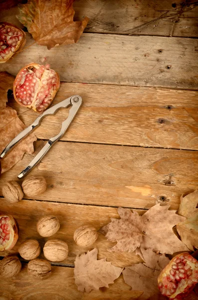 Autumn still life with pomegranates — Stock Photo, Image