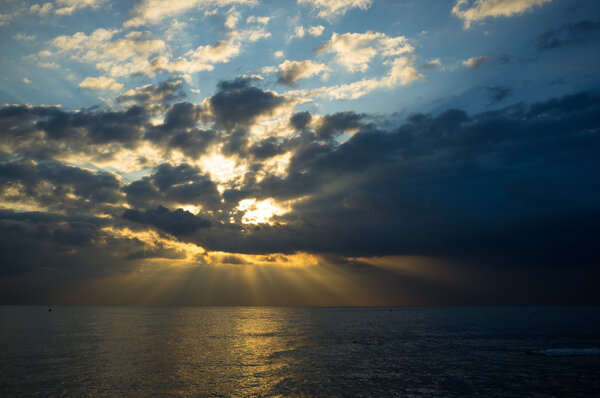 Storm clouds looming on calm Mediterranean waters