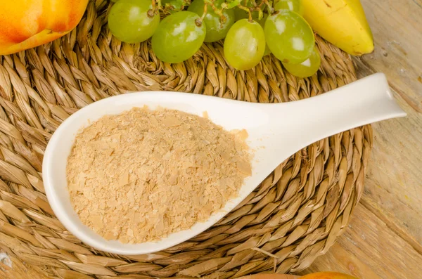 Spoon full of brewers yeast — Stock Photo, Image