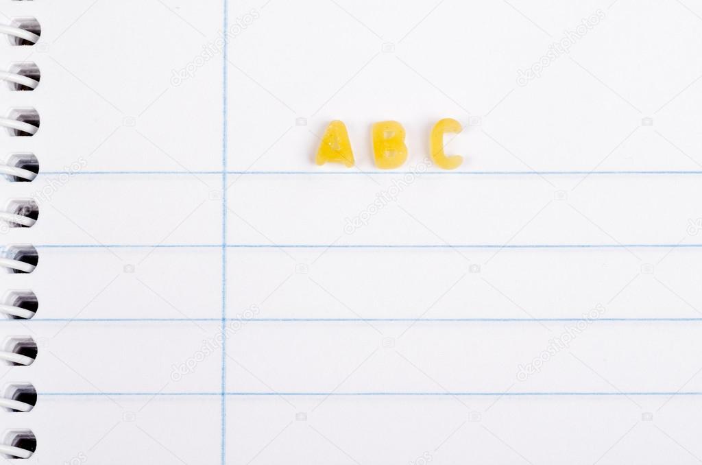 Pasta letters on notebook
