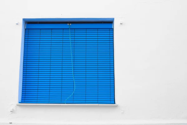 Blue window on white wall — Stock Photo, Image