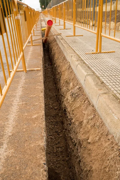 Trabajos de carretera con una zanja — Foto de Stock