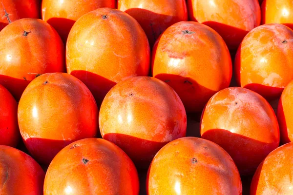 Persimon on a street market stall — Stock Photo, Image