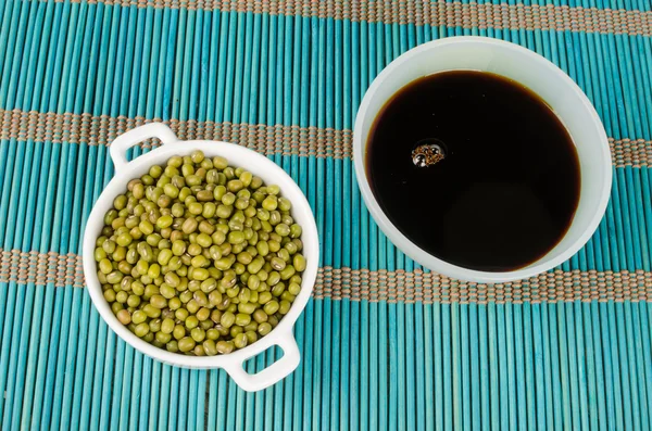 Bowls with soy sauce and soy beans — Stock Photo, Image