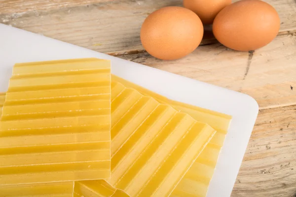 Lasagna sheets and eggs — Stock Photo, Image