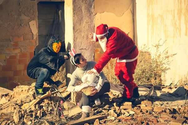 Santa and the Halloween monster stealing the eggs from the Easter Bunny — Stock Photo, Image