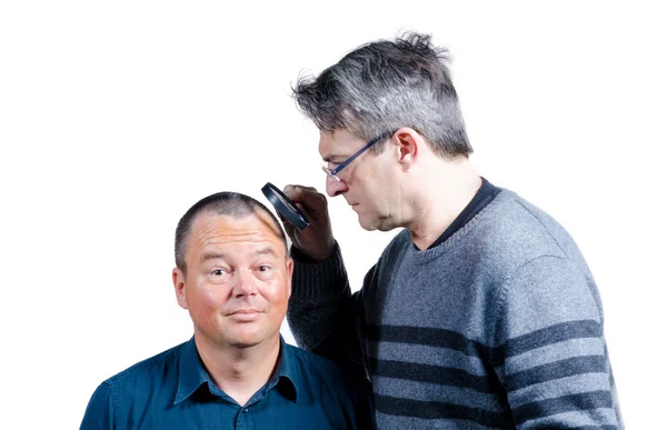 Inspecting his hair — Stock Photo, Image