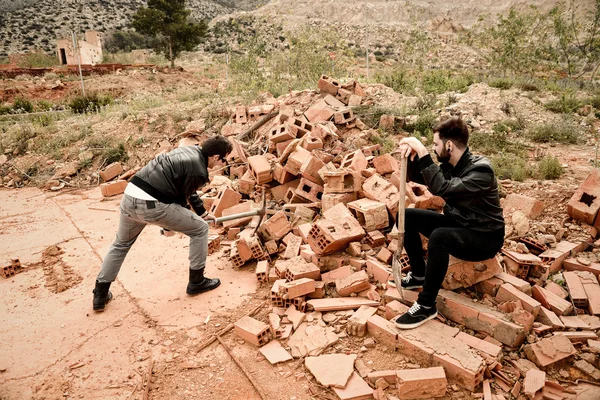 Hard working guy and onlooker — Stock Photo, Image