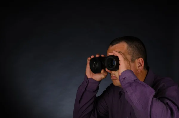 Man with photography lenses — Stock Photo, Image