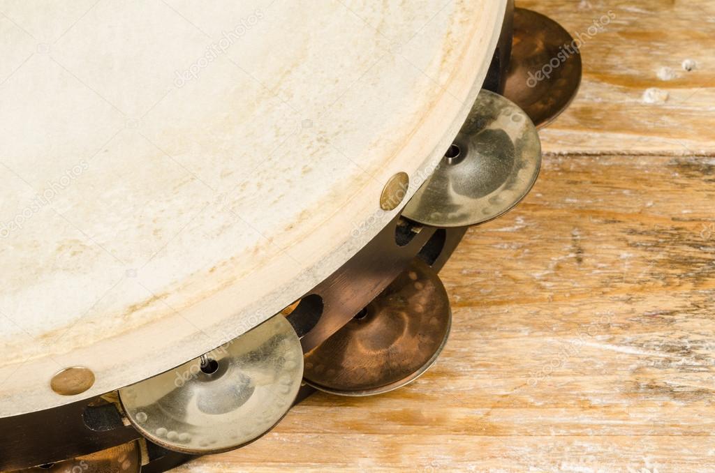 Tambourine on wood close up