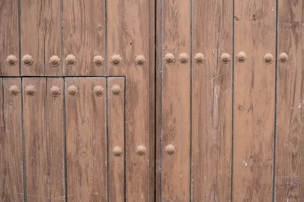 Riveted wooden door — 图库照片
