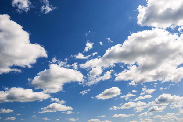 Blue sky with white heap clouds.