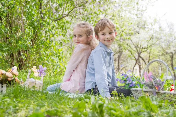 Brother and sister with easter decor — Stock Photo, Image