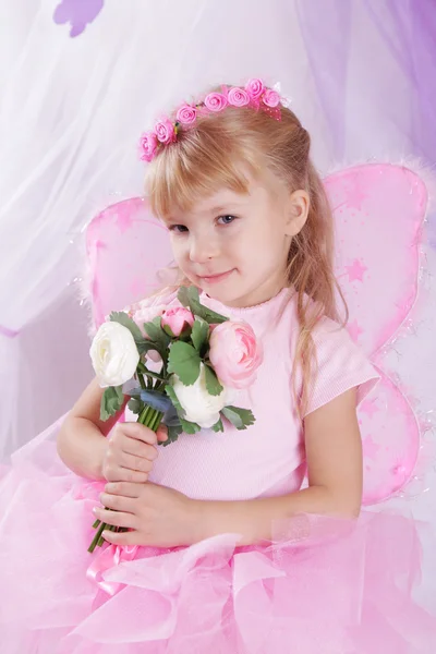 Butterfly girl in wreath holding roses — Stock Photo, Image