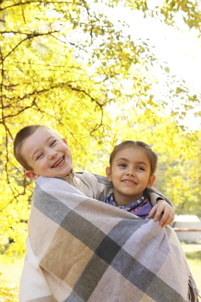 Sister and brother  in   autumn — Stock Photo, Image