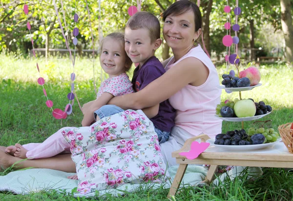 Mother with two children hugging — Stock Photo, Image