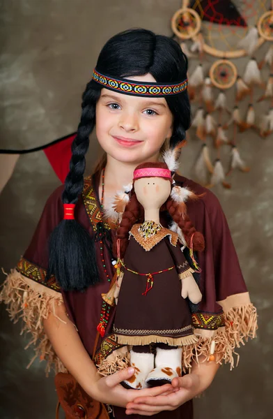 Baby girl in the national Indian clothes with a doll — Stock Photo, Image