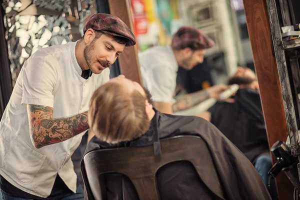Professional skillful barber shaving beard — Stock Photo, Image