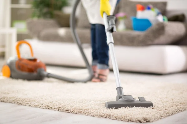 woman Vacuuming carpet