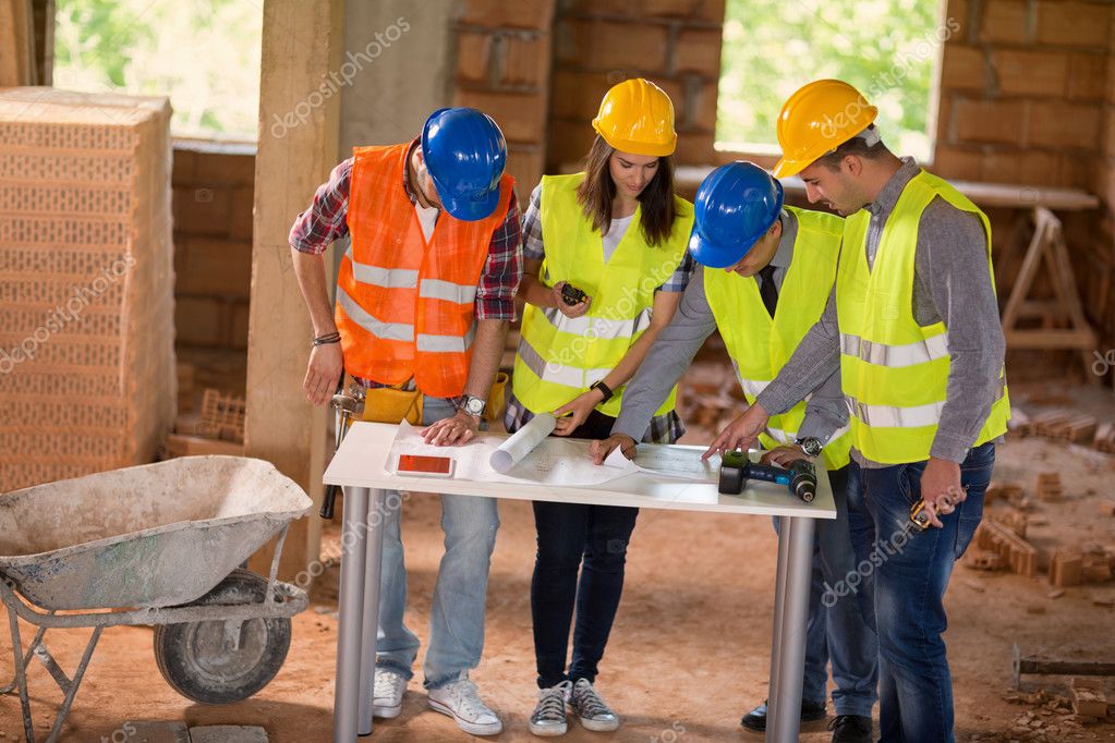 Architect explain details of plan to colleagues Stock Photo by
