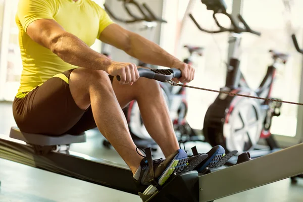 Exercise on row machine — Stock Photo, Image