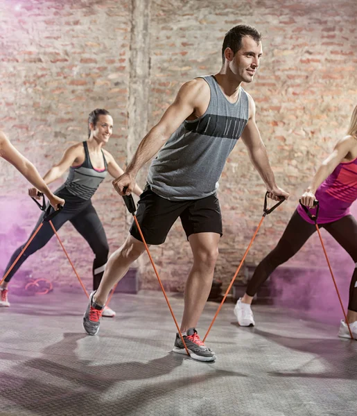 Exercising with stretching band — Stock Photo, Image