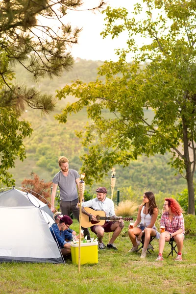 Young people in front of tent in nature — 图库照片